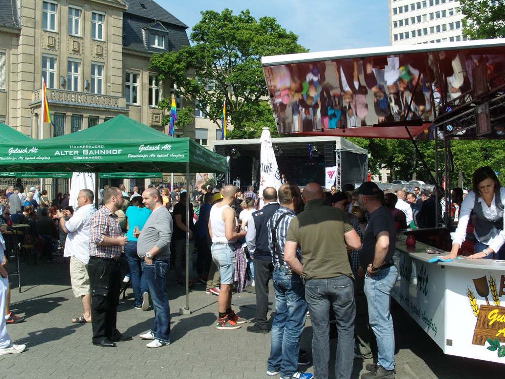 Crowd of people chatting and drinking