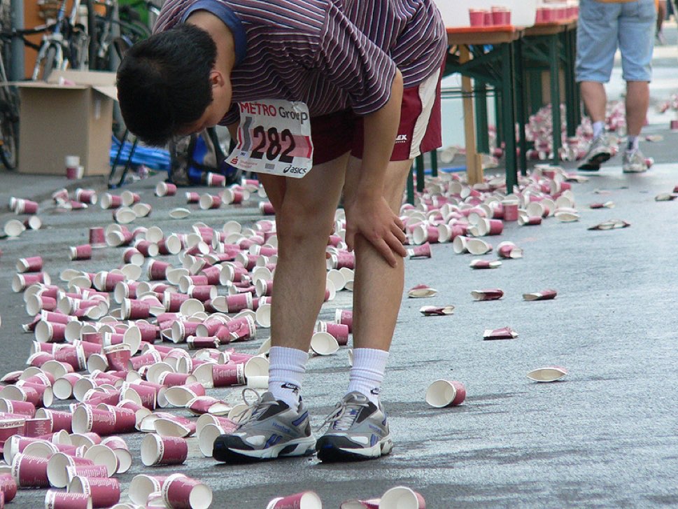 dus-ttd-events-marathon-1 Marathon runner taking pause among water cups