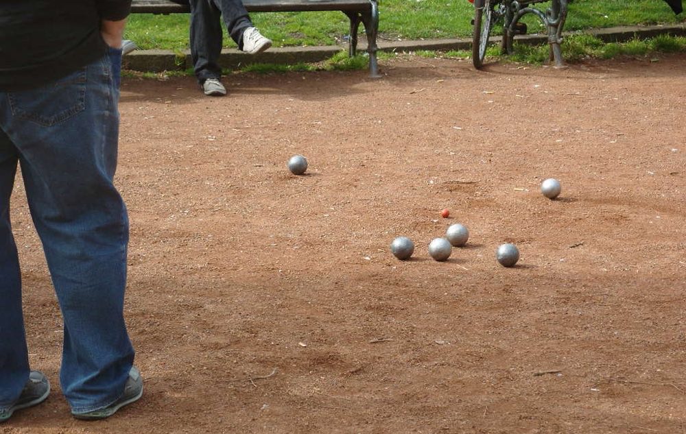 Boules balls on sandy play area