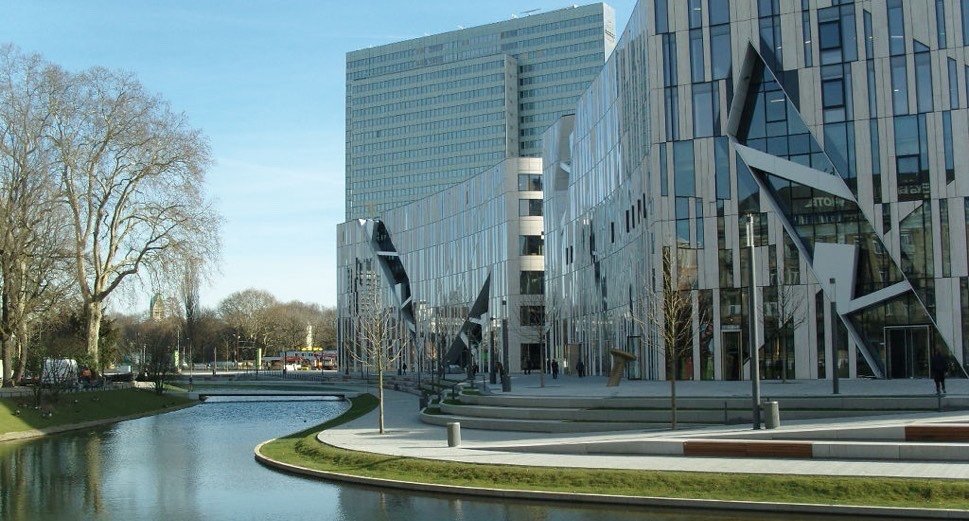 Modern architecture beside brook