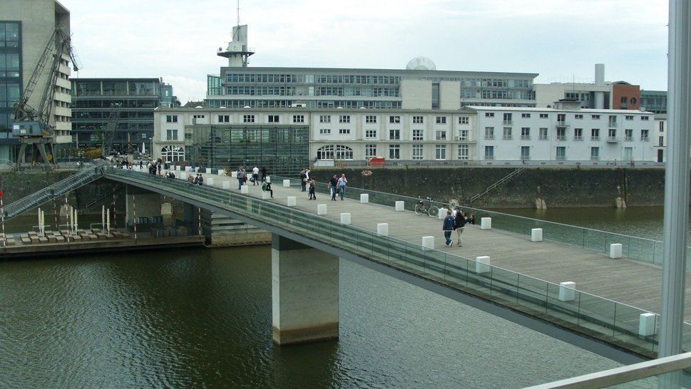 View over water with harbour buildings and bridge