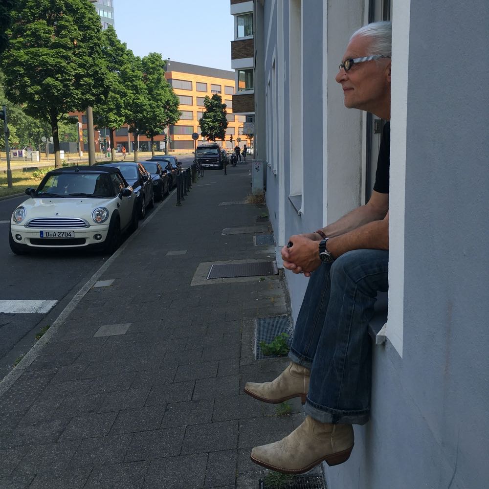 Man sitting on window sill