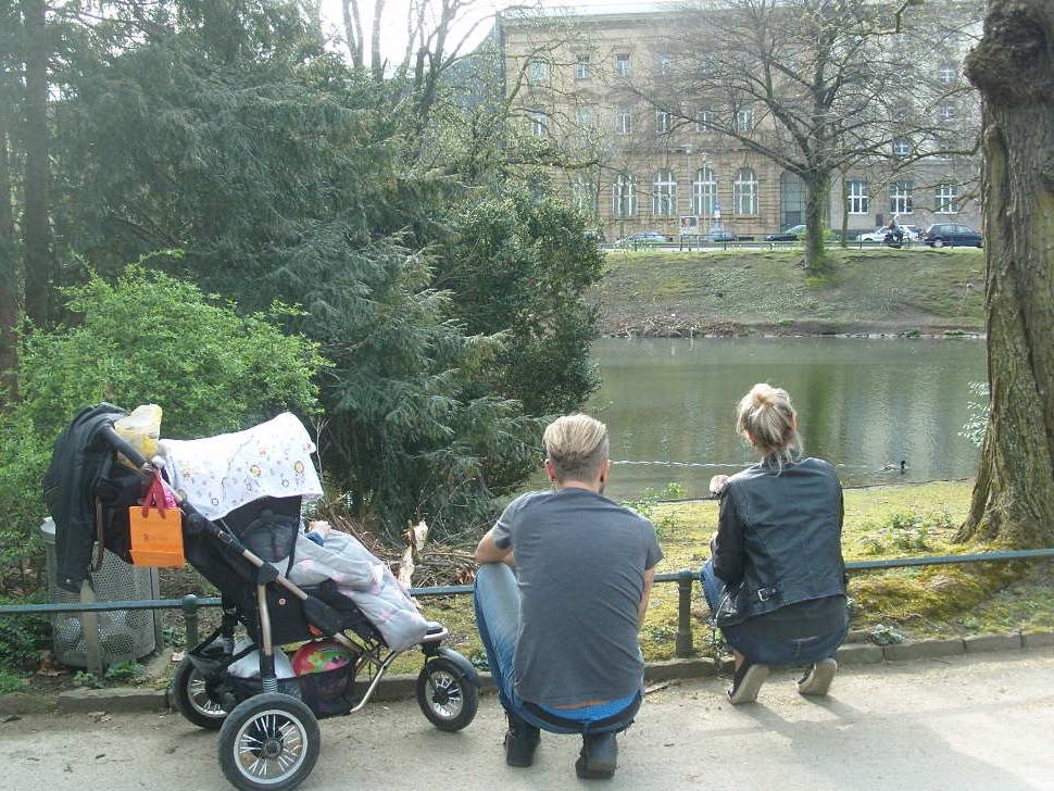 Couple with pram in park
