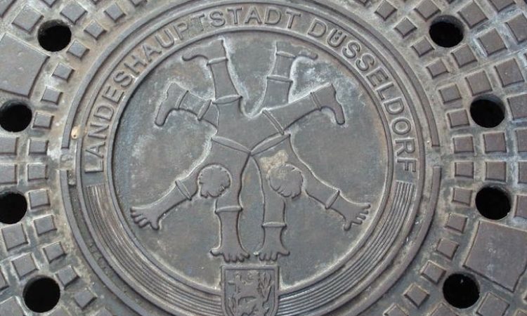Drain cover with emblem