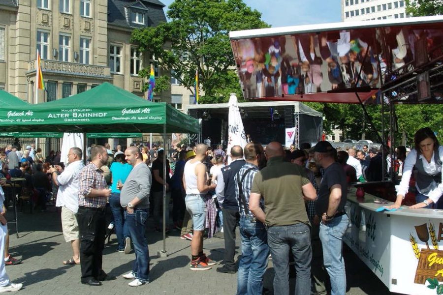 Crowd of people chatting and drinking