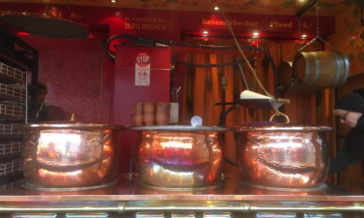 Christmas market stand with copper pots