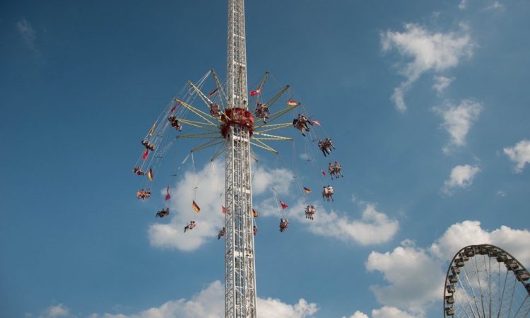 Funfair ride against blue sky