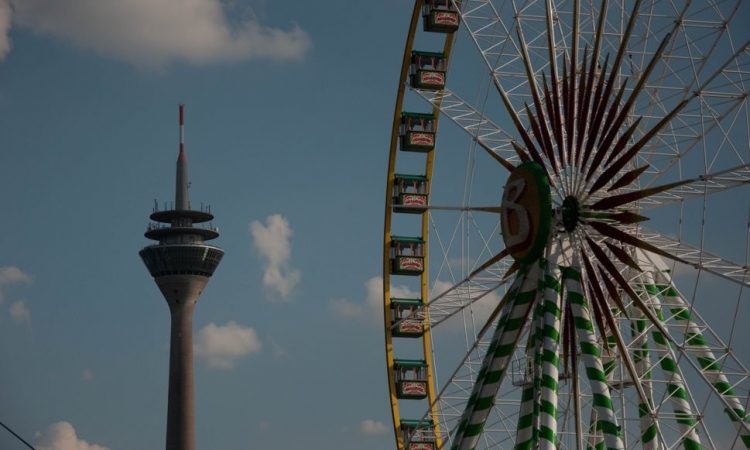 Funfair ferris wheel and communications tower