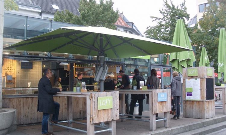 Fast food stand with customers eating