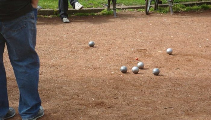 Boules balls on sandy play area